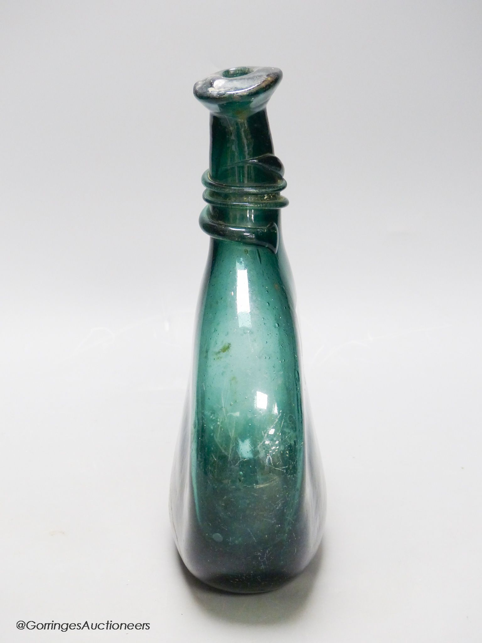 An 18th/19th century Persian green glass flask, Qajar dynasty, height 26cm